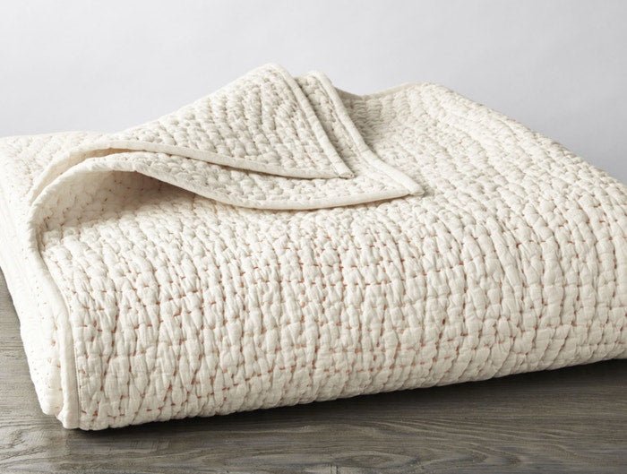 Coyuchi Pebbled Handstitched Organic Cotton Quilt in alpine white, hand-embroidered kantha style, organic cotton shell and batting
