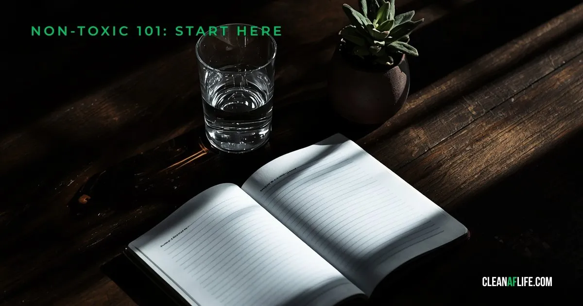 Non-toxic living for beginners guide checklist on dark wood table